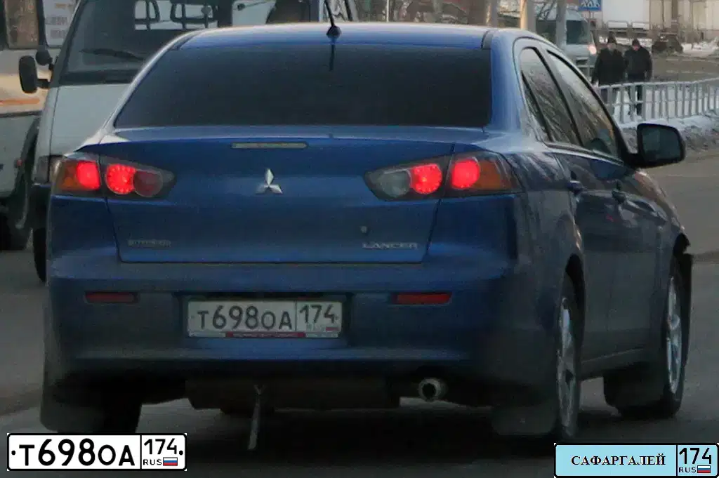 Фото автомобиля MITSUBISHI LANCER, 2011 — госномер Т698ОА174. Цвет: Синий