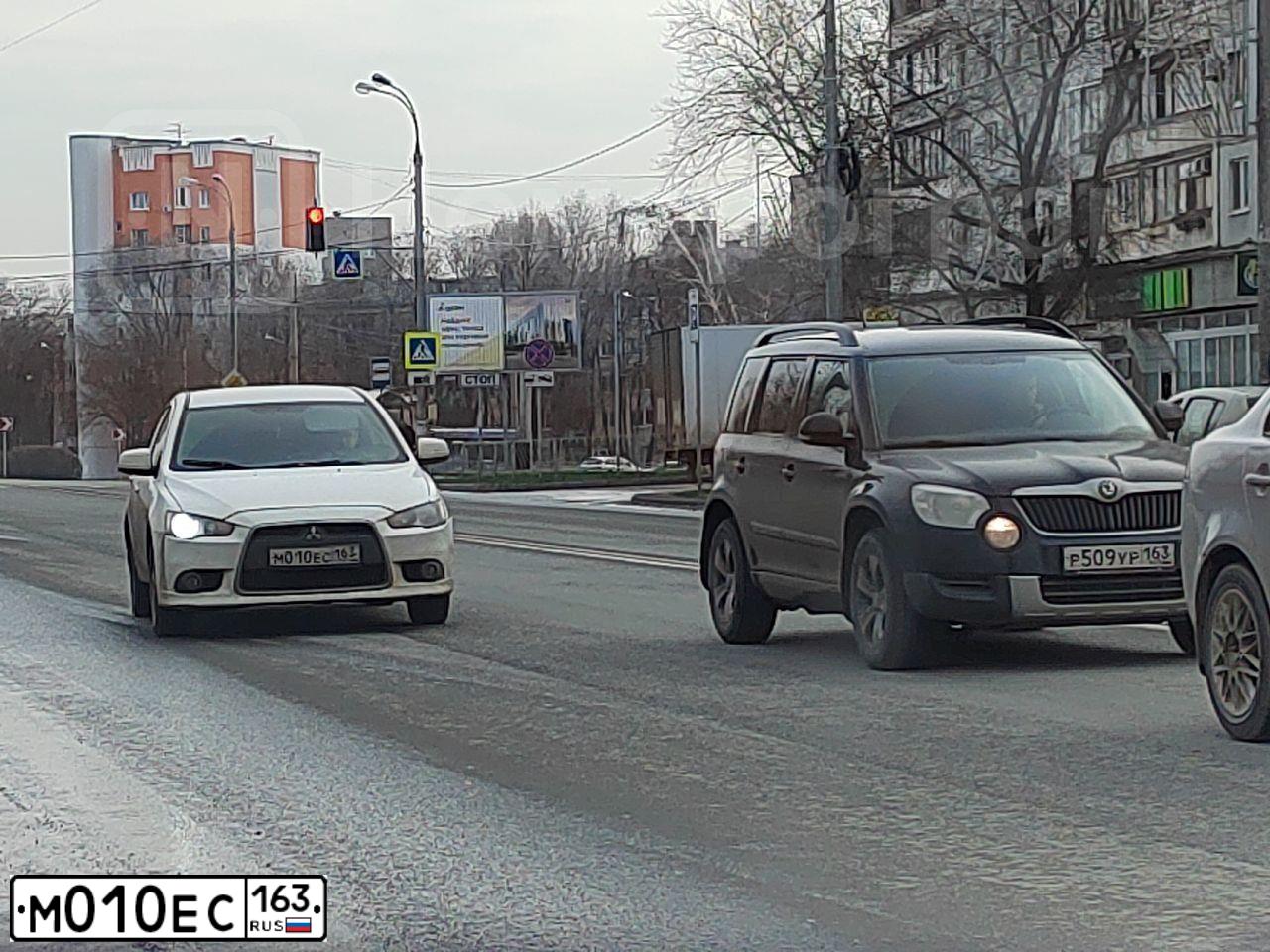 Фото автомобиля KIA SPECTRA, 2008 — госномер А303ХТ763. Цвет: Черный жемчуг (Чёрный)