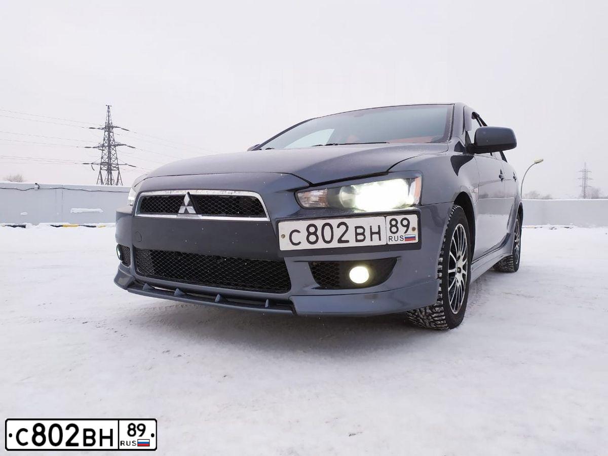 Фото автомобиля MITSUBISHI LANCER, 2007 — госномер К224АТ154. Цвет: СЕРЫЙ