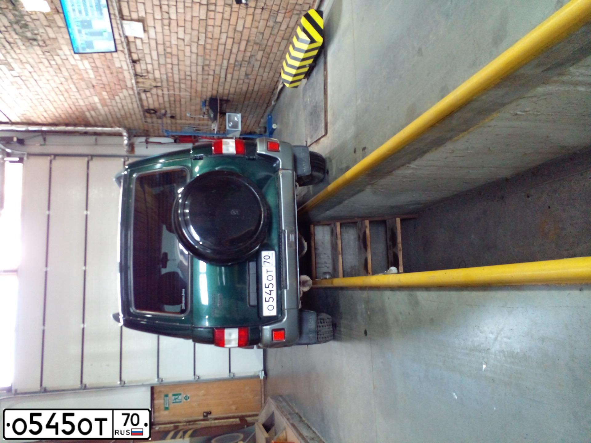 Фото автомобиля UAZ 3163 PATRIOT, 2008 — госномер О545ОТ70. Цвет: ТЕМНО-ЗЕЛЕНЫЙ
