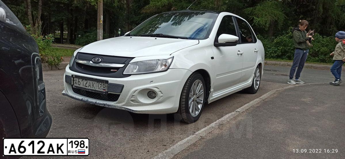 Фото автомобиля LADA 2190 GRANTA, 2018 — госномер Н528ХА124. Цвет: Белый