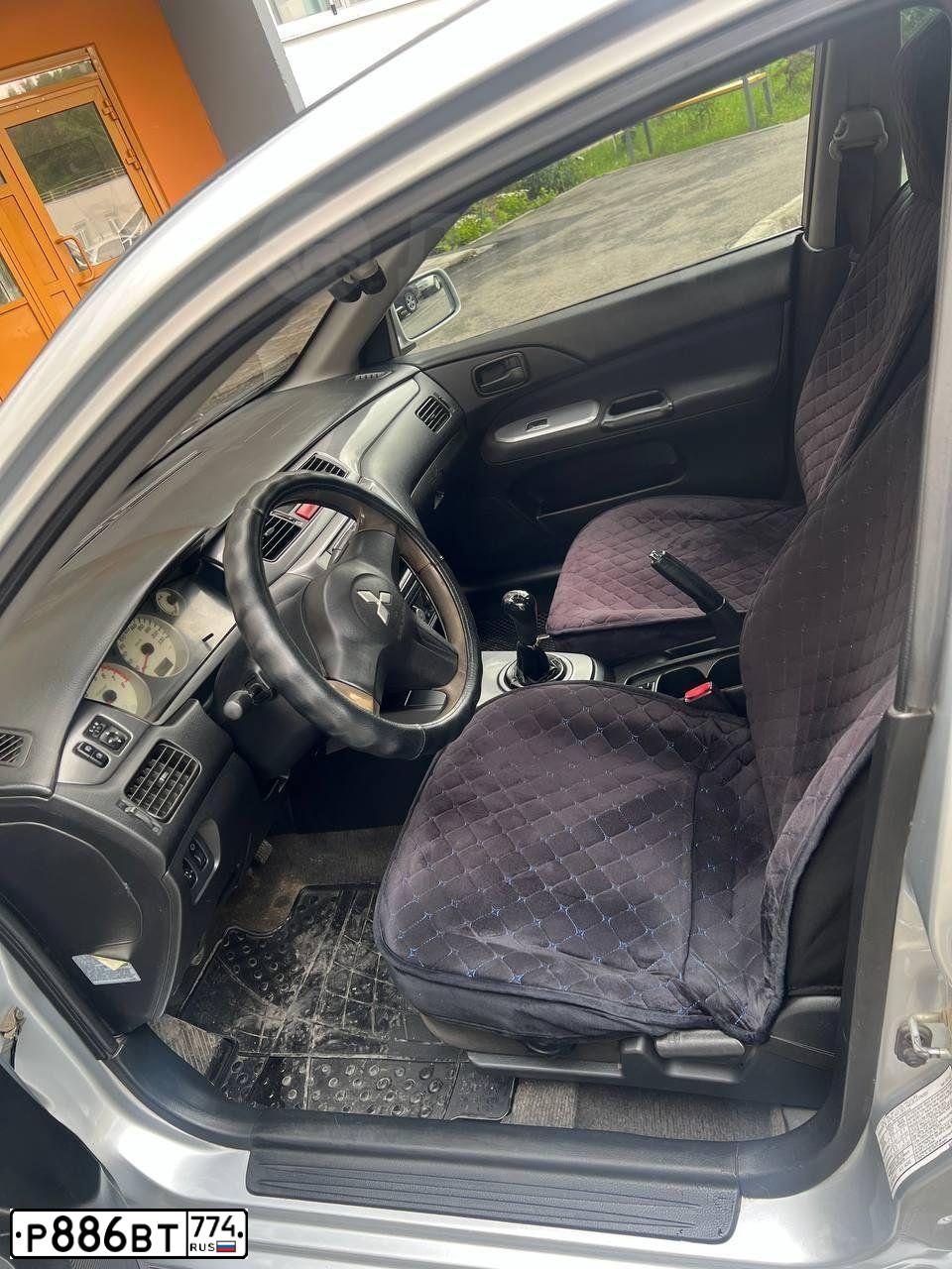 Фото автомобиля MITSUBISHI LANCER, 2006 — госномер Р886ВТ774. Цвет: Серебристый