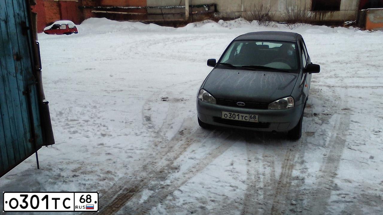 Фото автомобиля LADA 1117 KALINA, 2010 — госномер О301ТС68. Цвет: Темно-серый металлик