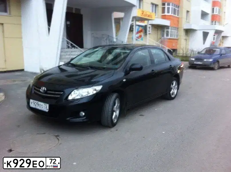 Фото автомобиля TOYOTA COROLLA, 2007 — госномер К929ЕО72. Цвет: ЧЕРНЫЙ
