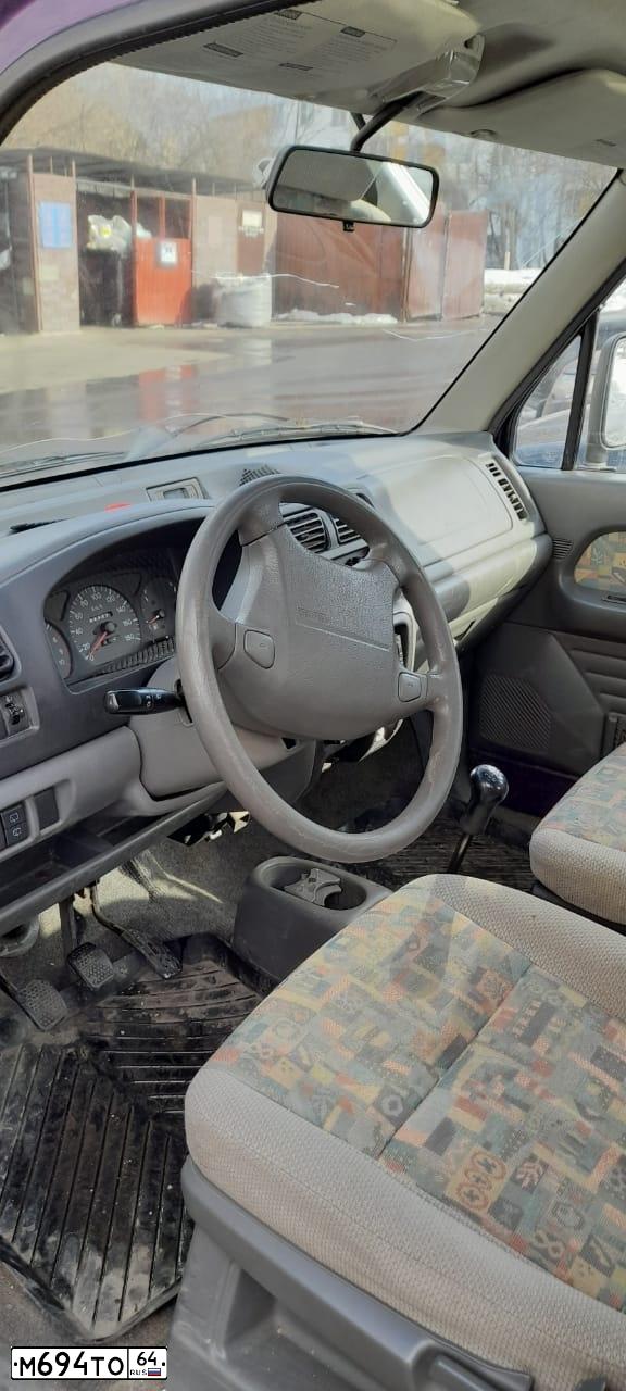 Фото автомобиля RENAULT LOGAN, 2006 — госномер Е798ЕО164. Цвет: ТЕМНО СЕРЫЙ