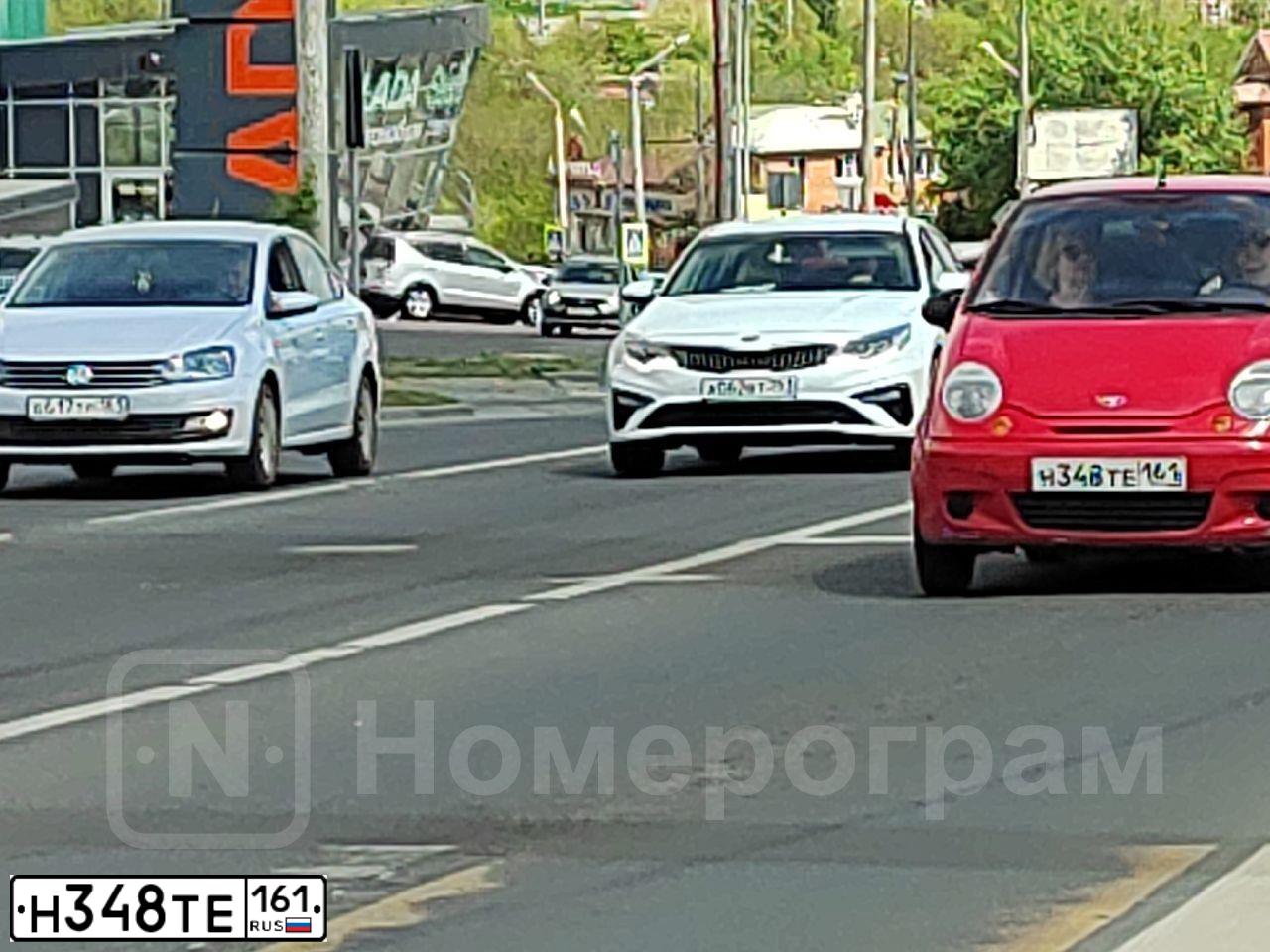 Фото автомобиля DAEWOO MATIZ, 2013 — госномер Н348ТЕ161. Цвет: ЯРКО-КРАСНЫЙ