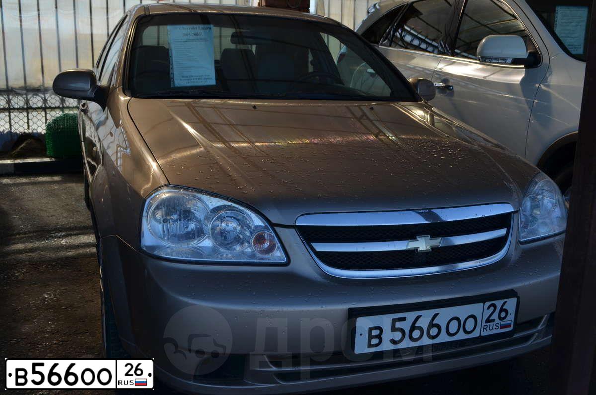 Фото автомобиля CHEVROLET LACETTI, 2005 — госномер Т232АЕ15. Цвет: БЕЖЕВЫЙ