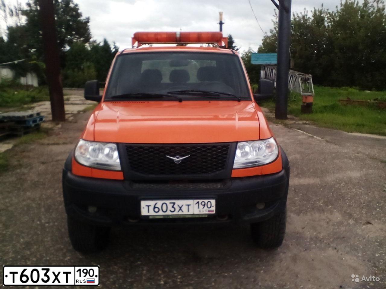 Фото автомобиля UAZ 2363 PICKUP, 2012 — госномер Т603ХТ190. Цвет: ОРАНЖЕВЫЙ