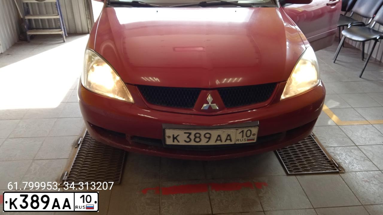 Фото автомобиля MITSUBISHI LANCER, 2008 — госномер К389АА10. Цвет: КРАСНЫЙ