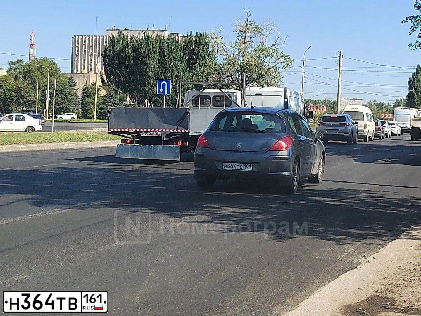 Фото автомобиля PEUGEOT 308, 2009 — госномер Н364ТВ161. Цвет: ТЕМНО СЕРЫЙ