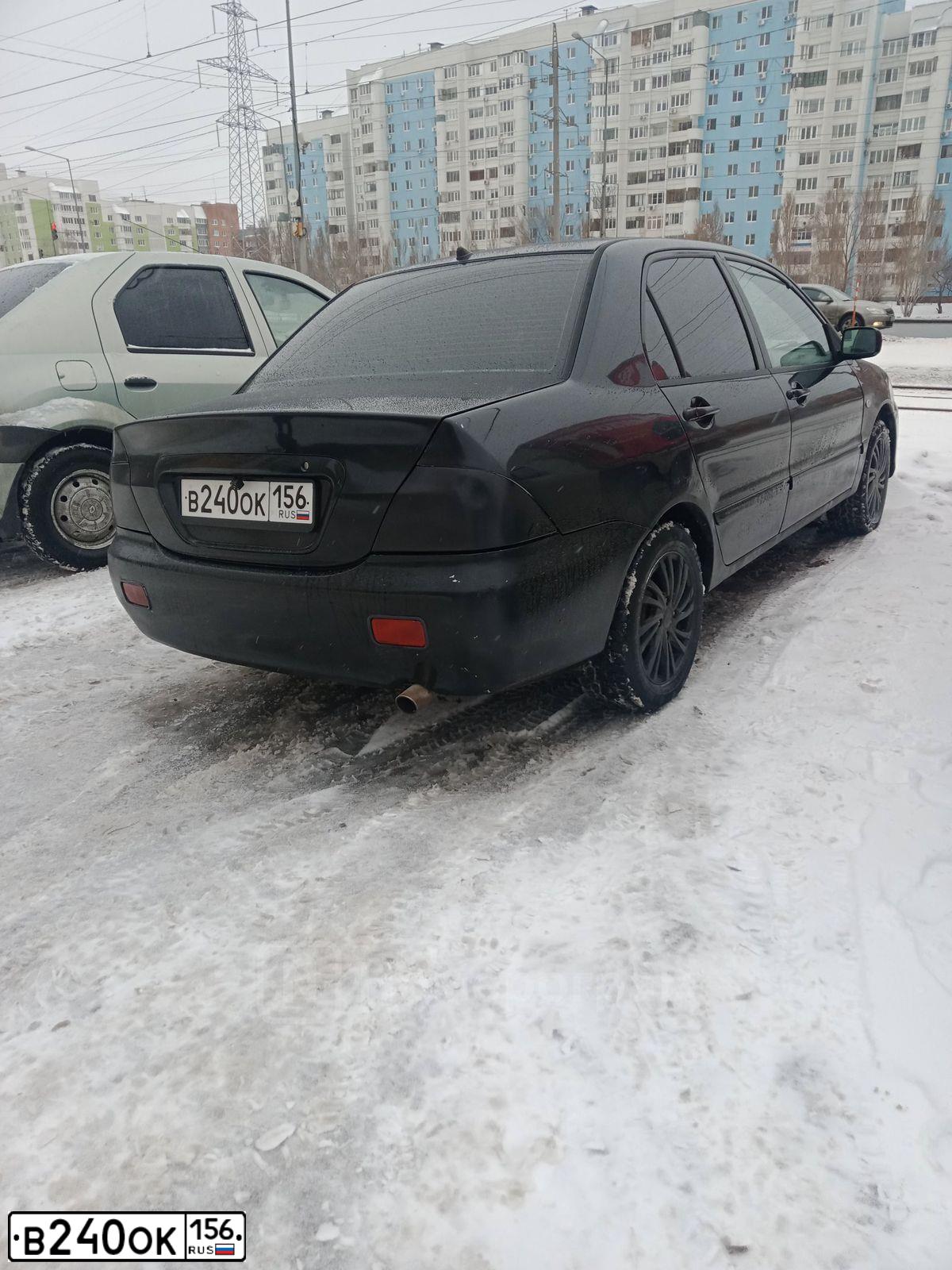 Фото автомобиля MITSUBISHI LANCER, 2004 — госномер В240ОК156. Цвет: ЧЕРНЫЙ
