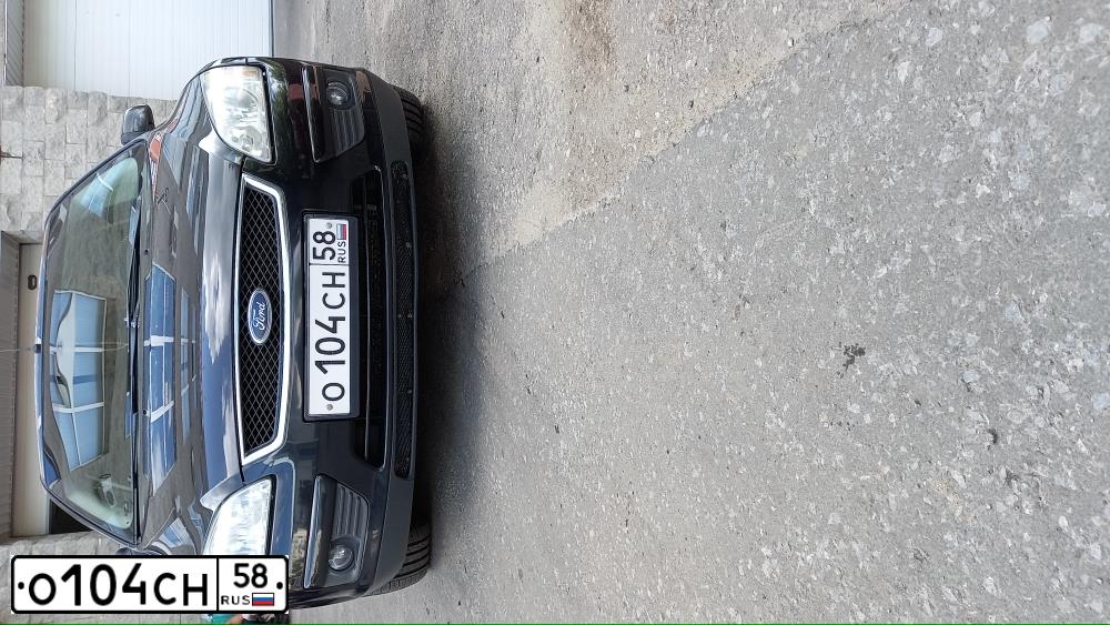 Фото автомобиля FORD FOCUS, 2007 — госномер О104СН58. Цвет: ЧЕРНЫЙ