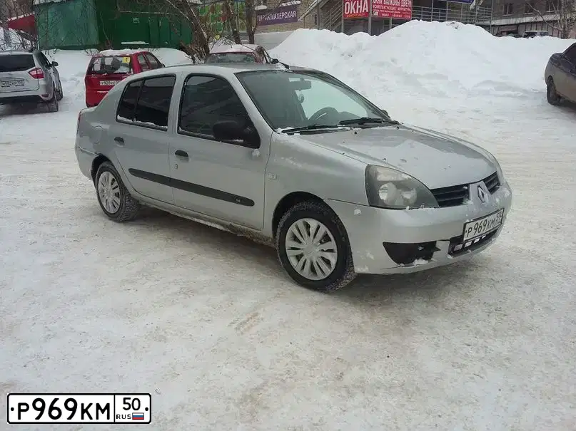 Фото автомобиля MITSUBISHI LANCER, 2006 — госномер Н945ВА977. Цвет: СЕРЫЙ