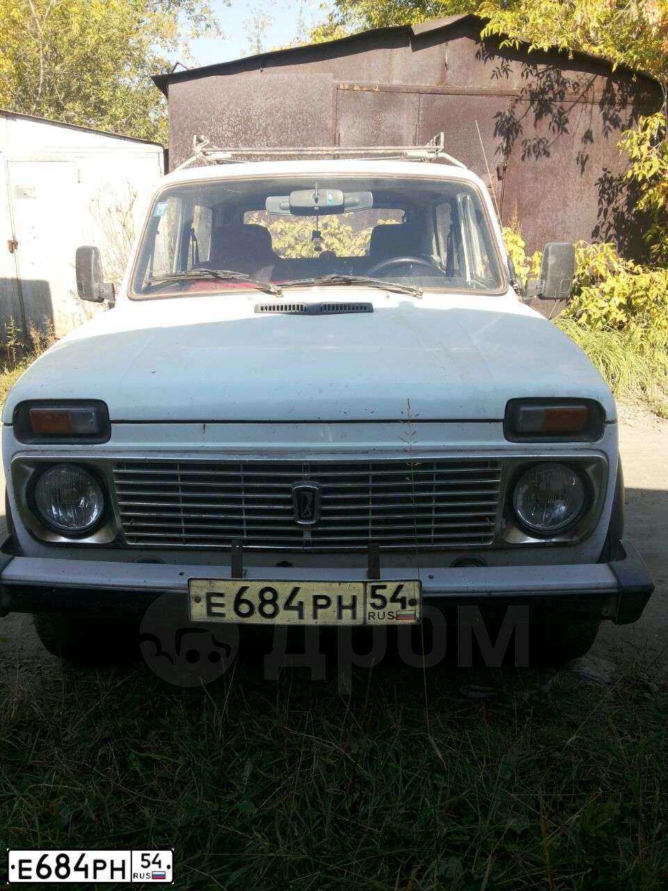 Фото автомобиля LADA 2121 NIVA, 1993 — госномер Е684РН54. Цвет: Белый