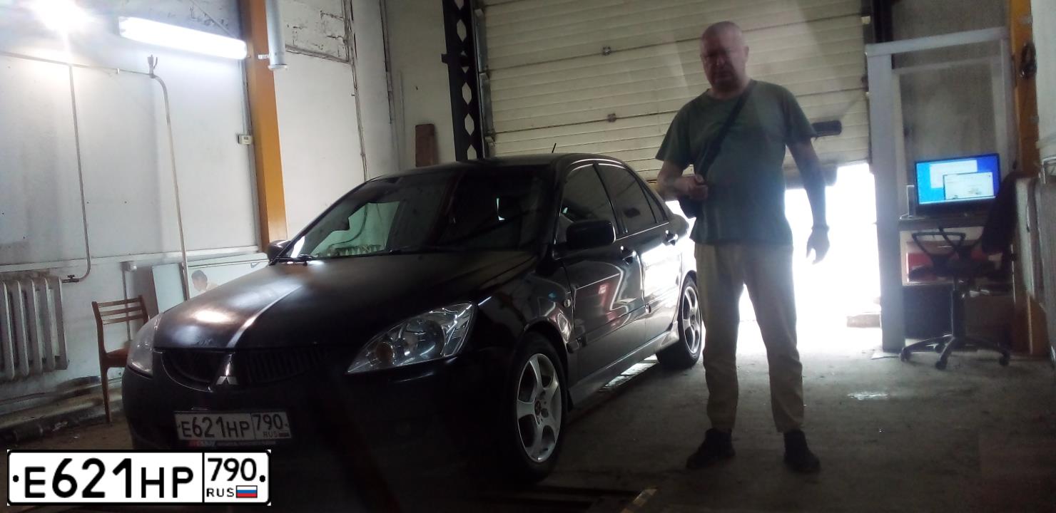 Фото автомобиля MITSUBISHI LANCER, 2005 — госномер В912ХВ199. Цвет: ЧЕРНЫЙ
