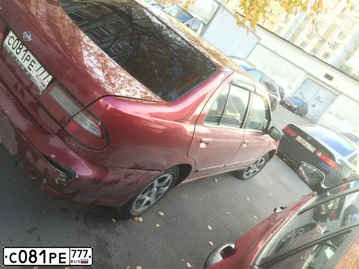 Фото автомобиля NISSAN ALMERA, 2000 — госномер С117ХР177. Цвет: КРАСНЫЙ ТЕМНЫЙ