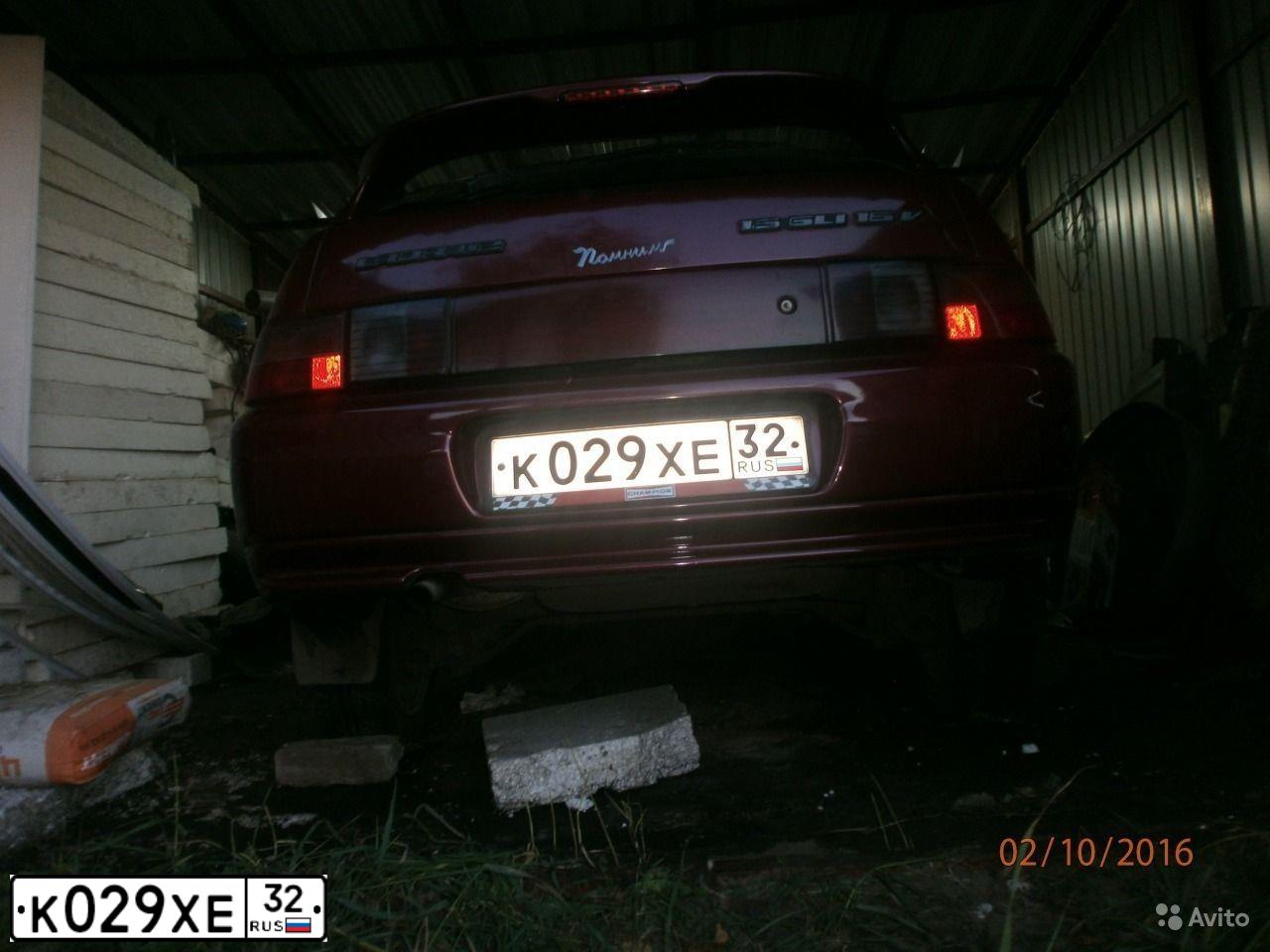 Фото автомобиля LADA 2112, 2003 — госномер Р602ОУ40. Цвет: ТЕМНО-МАЛИНОВЫЙ
