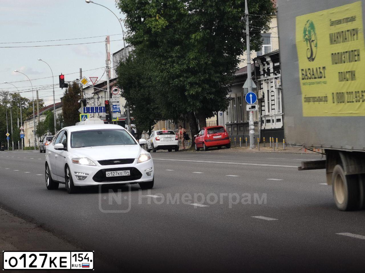 Фото автомобиля FORD MONDEO, 2011 — госномер О127КЕ154. Цвет: БЕЛЫЙ