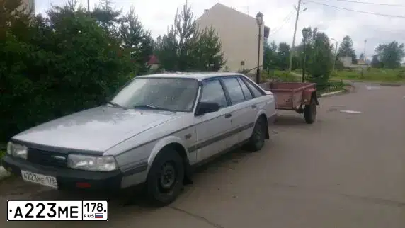 Фото автомобиля MAZDA 626, 1985 — госномер А223МЕ178. Цвет: Белый