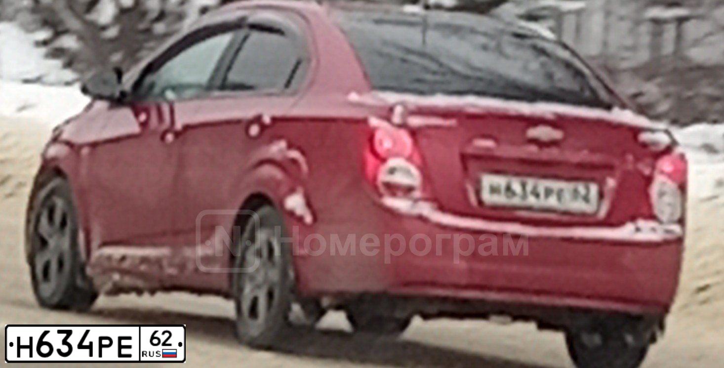 Фото автомобиля CHEVROLET AVEO, 2012 — госномер Н634РЕ62. Цвет: Красный