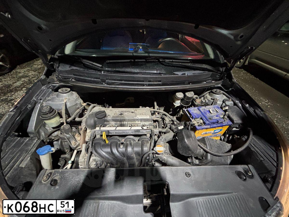 Фото автомобиля KIA RIO, 2012 — госномер К068НС51. Цвет: СЕРЫЙ