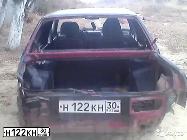 Фото автомобиля LADA 2109 SAMARA, 1993 — госномер Н122КН30. Цвет: ВИШНЕВЫЙ