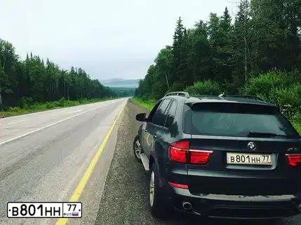 Фото автомобиля BMW X5, 2010 — госномер В086МО41. Цвет: Серый