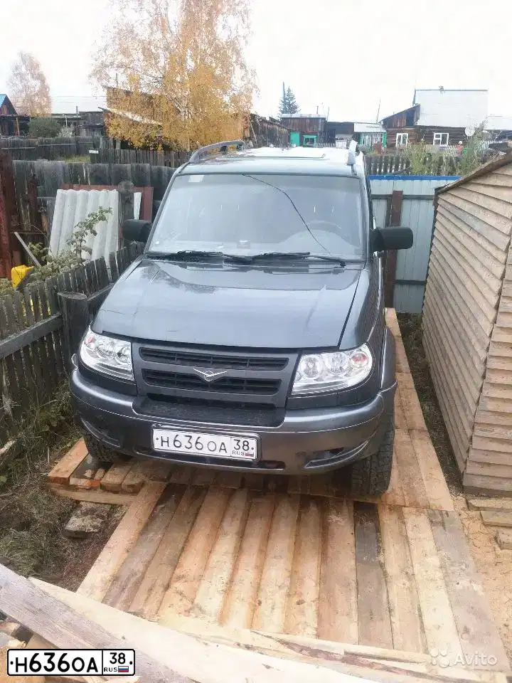 Фото автомобиля UAZ 3163 PATRIOT, 2006 — госномер Н636ОА38. Цвет: СЕРО-ЗЕЛЕНЫЙ