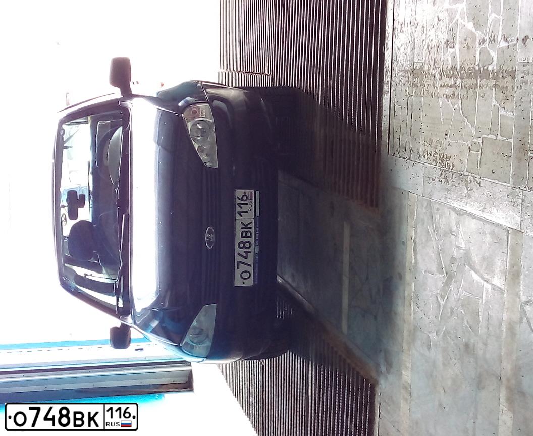 Фото автомобиля LADA 1119 KALINA, 2011 — госномер В041МН702. Цвет: Сине-Черный
