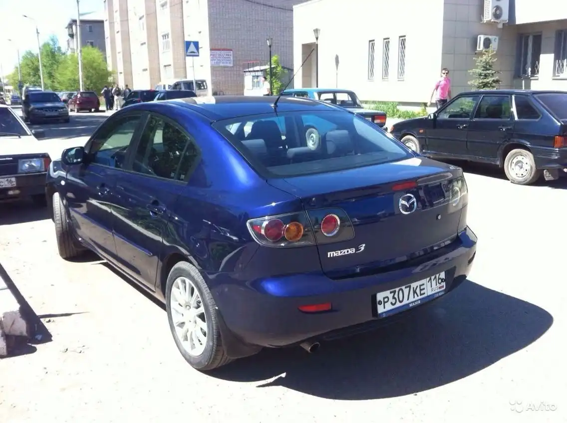Фото автомобиля MAZDA A 3, 2006 — госномер Т090АМ150. Цвет: ЧЕРНЫЙ