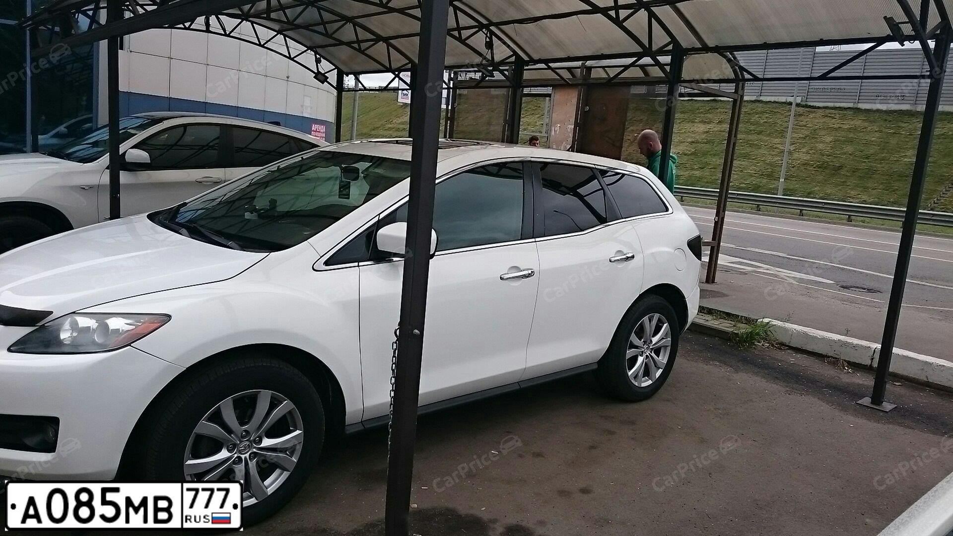 Фото автомобиля MAZDA CX-7, 2006 — госномер Е035СС08. Цвет: Белый