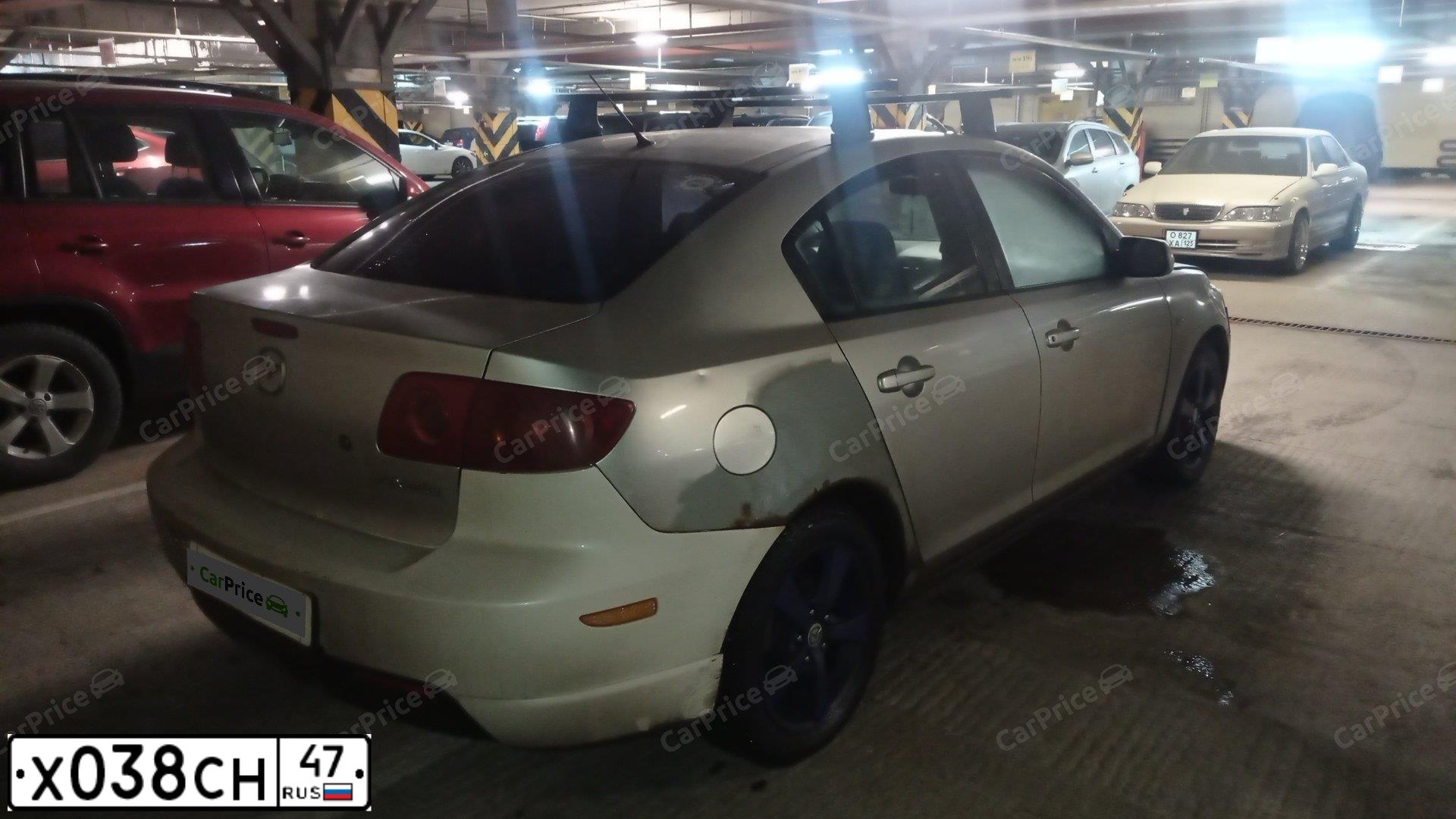 Фото автомобиля MAZDA 3, 2004 — госномер Х038СН47. Цвет: СЕРЫЙ