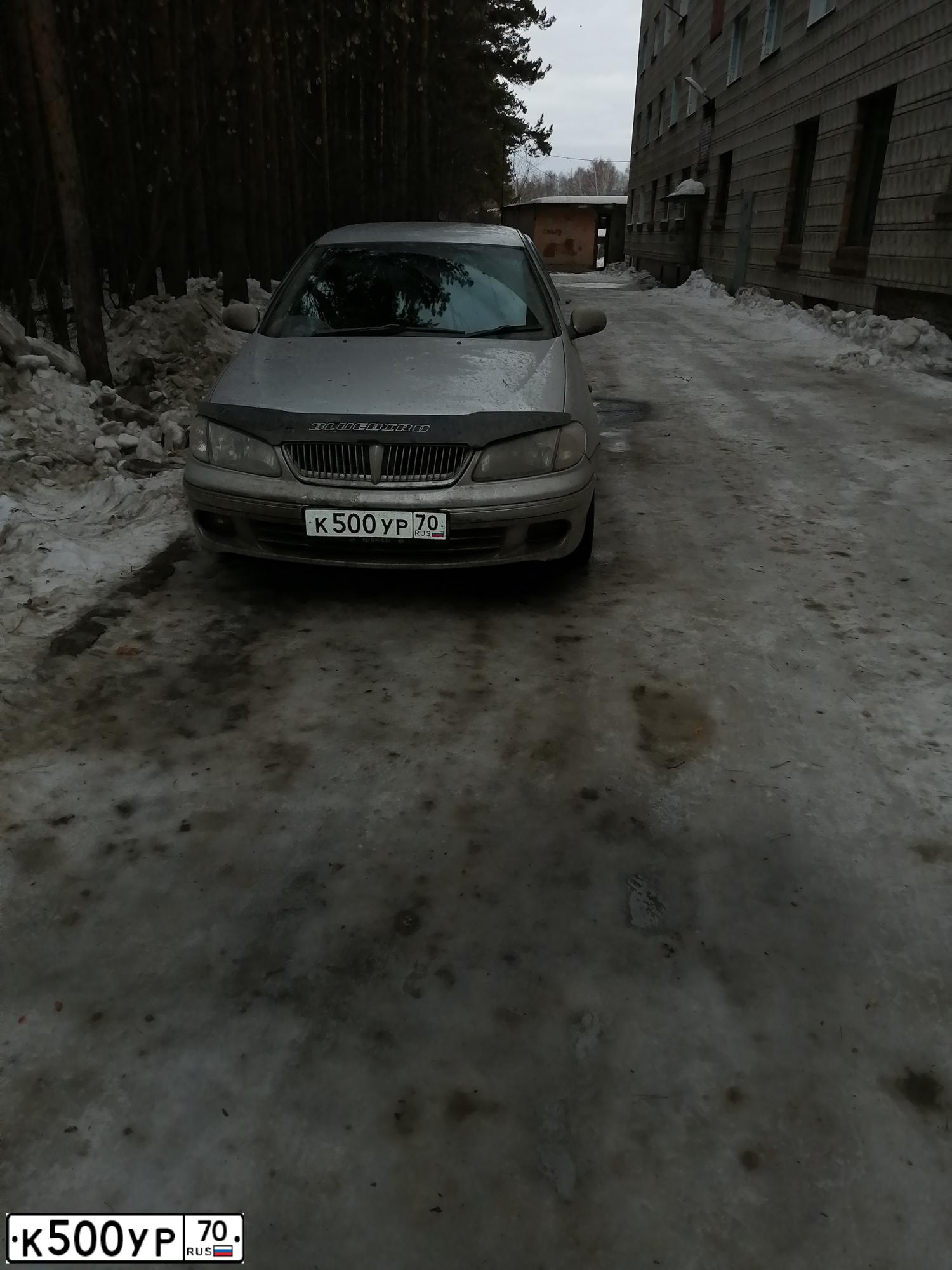 Фото автомобиля NISSAN SUNNY, 2000 — госномер К500УР70. Цвет: СЕРЫЙ