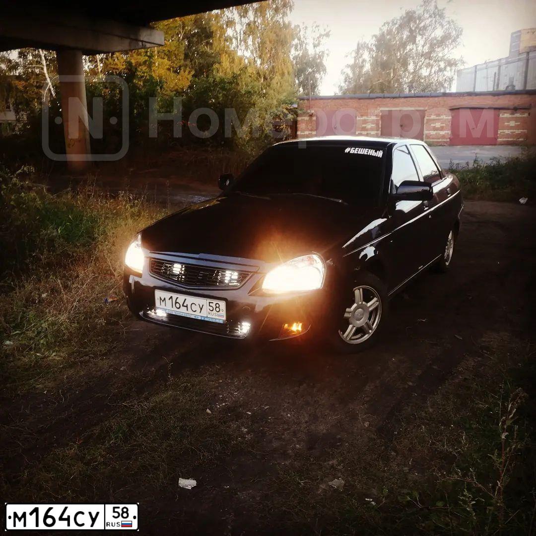 Фото автомобиля LADA 2170 PRIORA, 2009 — госномер М164СУ58. Цвет: СИНЕ-ЧЕРНЫЙ