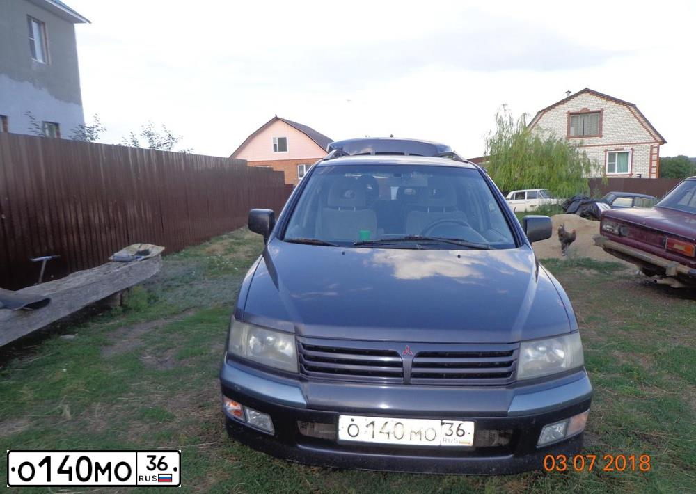 Фото автомобиля MITSUBISHI SPACE WAGON, 1999 — госномер Т909ТН62. Цвет: ФИОЛЕТОВЫЙ