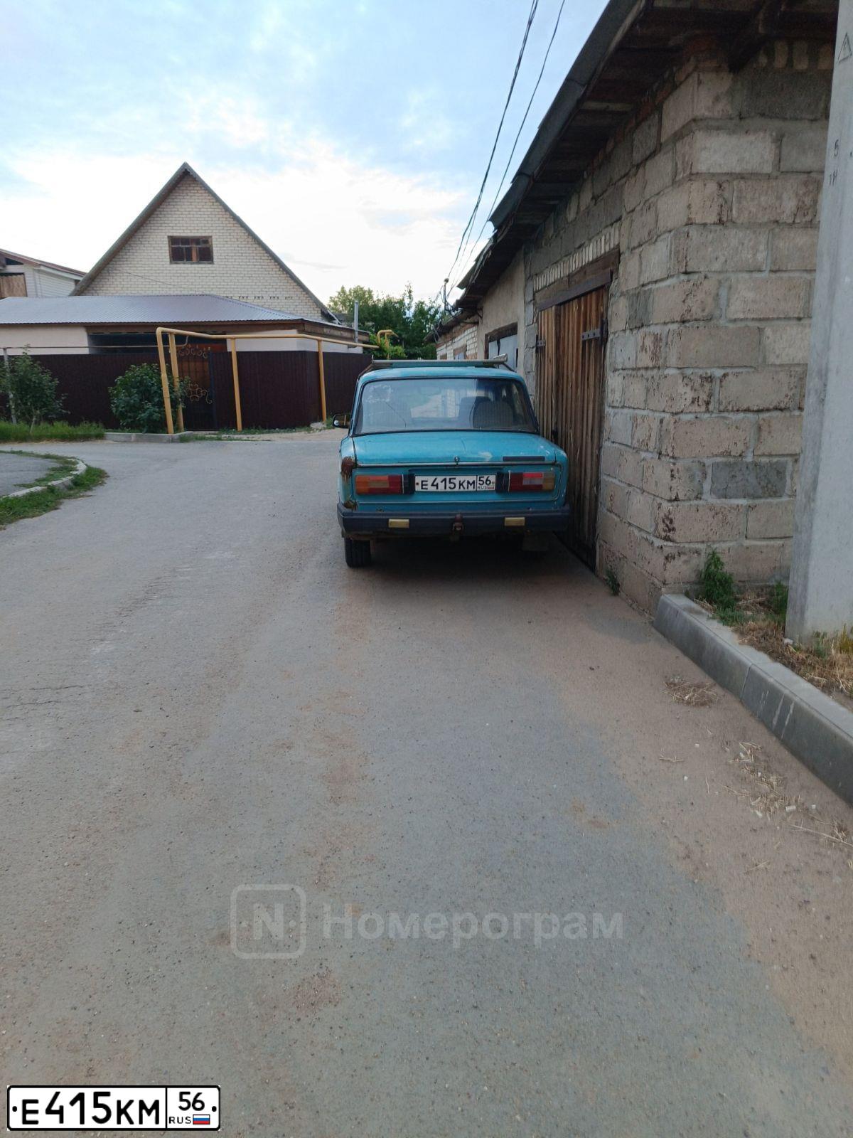 Фото автомобиля LADA 2106, 1974 — госномер Е415КМ56. Цвет: СИНЕ-ЗЕЛЕНЫЙ