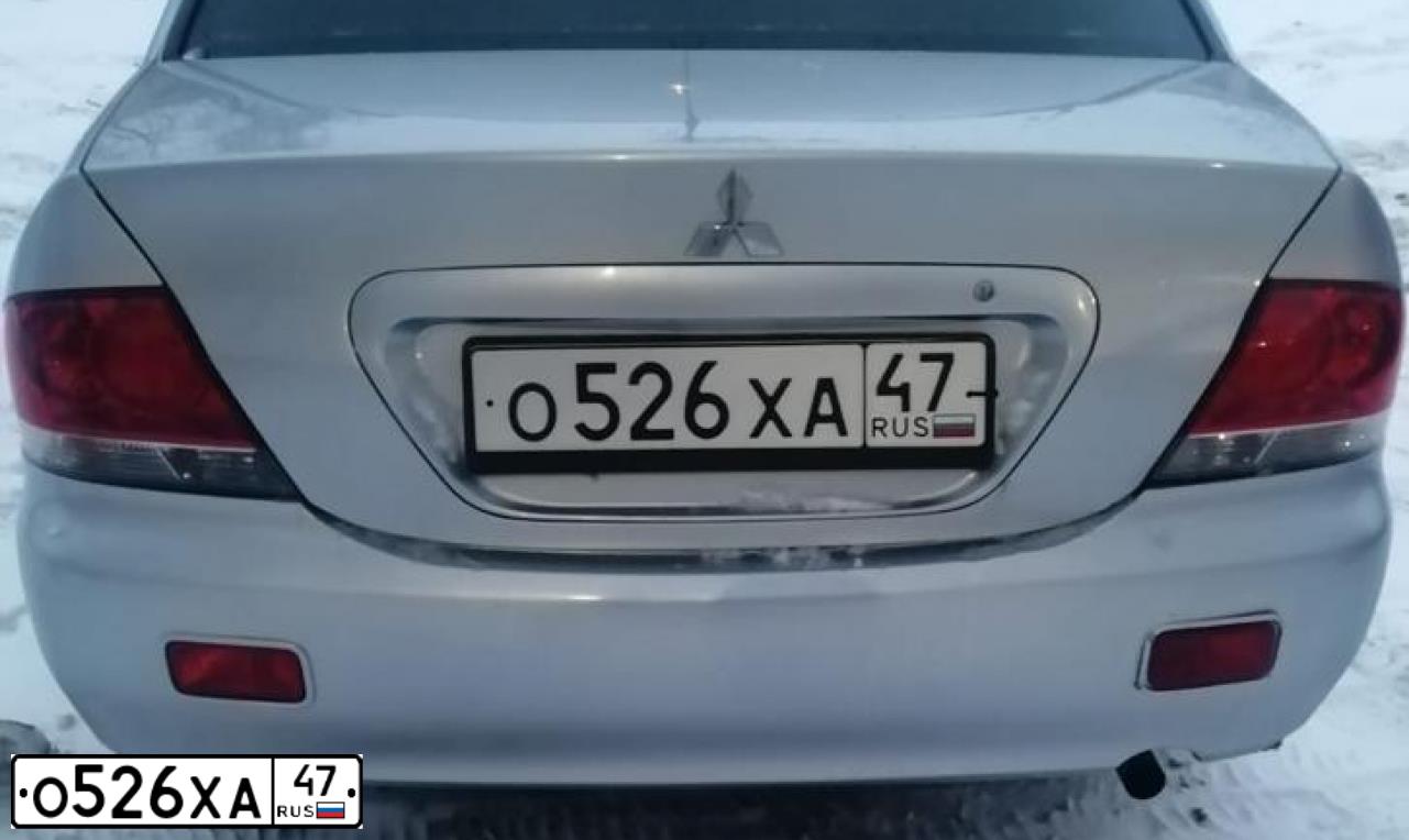 Фото автомобиля MITSUBISHI LANCER, 2009 — госномер Е939ВТ11. Цвет: Серебристый