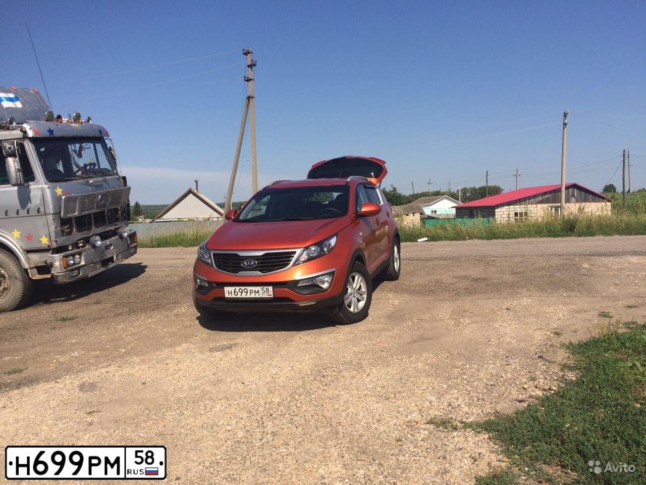 Фото автомобиля KIA SPORTAGE, 2011 — госномер М519УЕ13. Цвет: Оранжевый