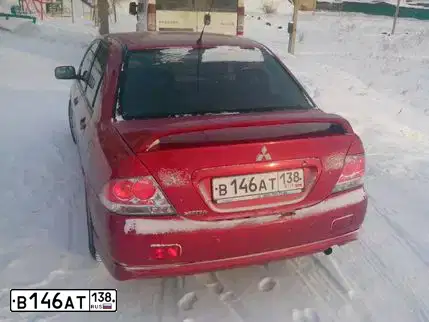 Фото автомобиля MITSUBISHI LANCER 2.0, 2005 — госномер В343КС138. Цвет: Красный
