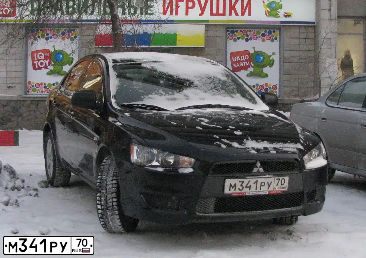 Фото автомобиля MITSUBISHI LANCER, 2010 — госномер С619ЕО154. Цвет: ЧЕРНЫЙ