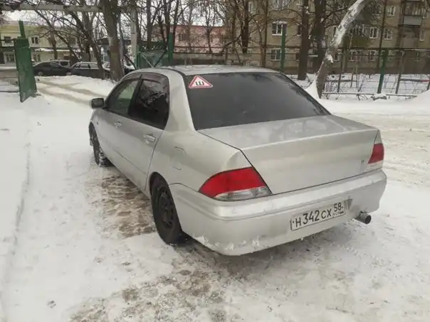 Фото автомобиля MITSUBISHI LANCER, 2002 — госномер Н342СХ58