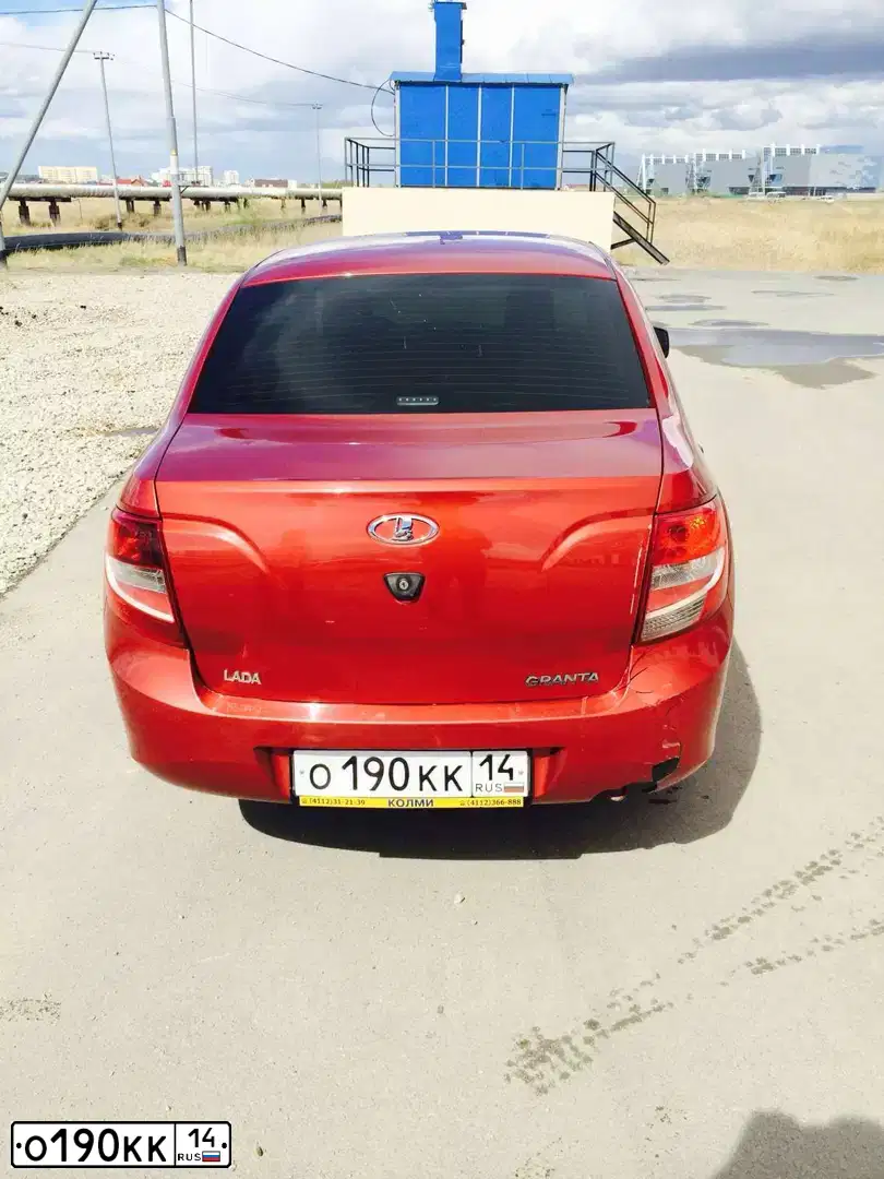 Фото автомобиля LADA 2190 GRANTA, 2012 — госномер О190КК14. Цвет: СЕРЕБРИСТО-КРАСНЫЙ