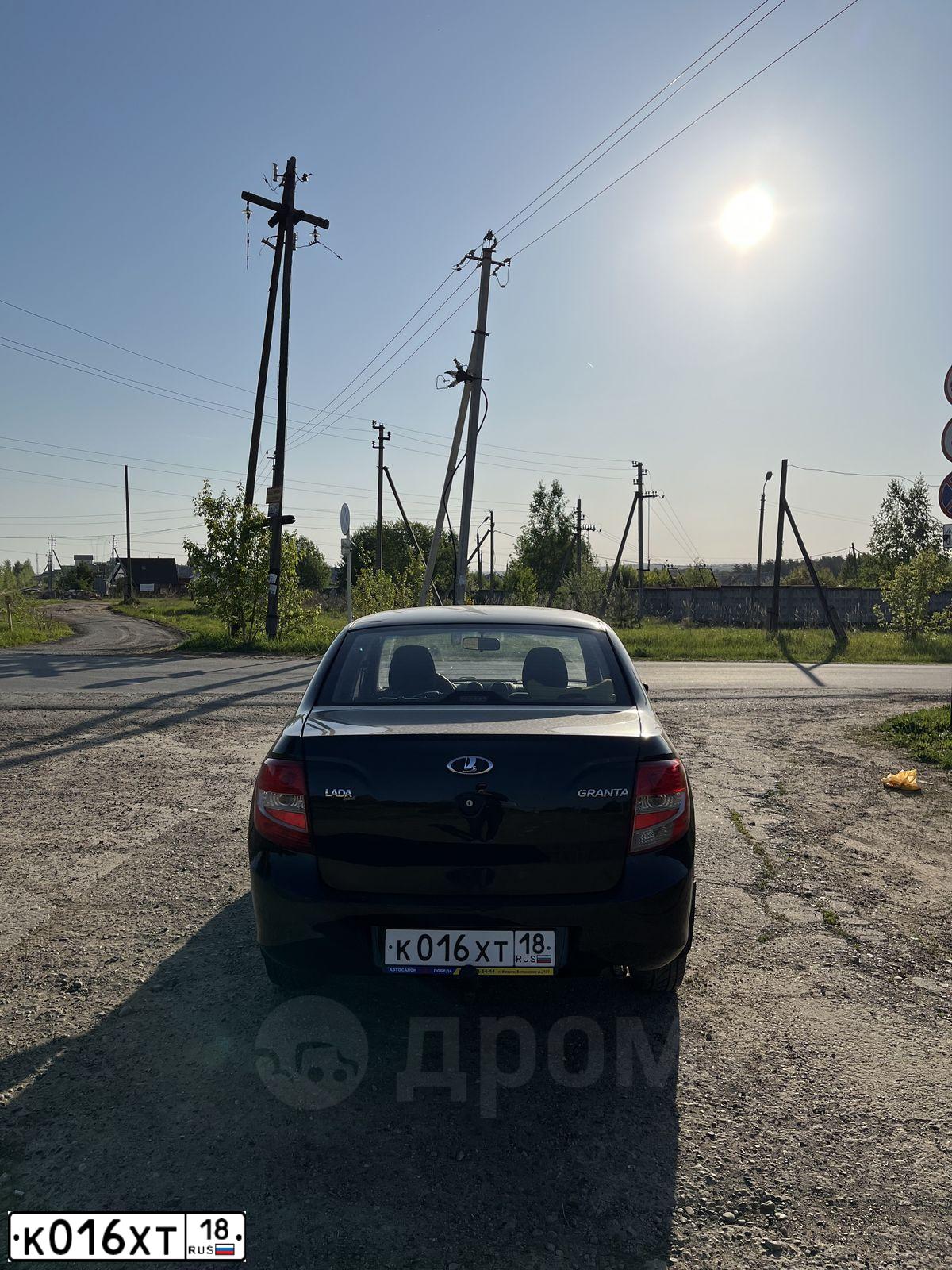 Фото автомобиля LADA 2190 GRANTA, 2015 — госномер О110КН18. Цвет: ЧЕРНЫЙ