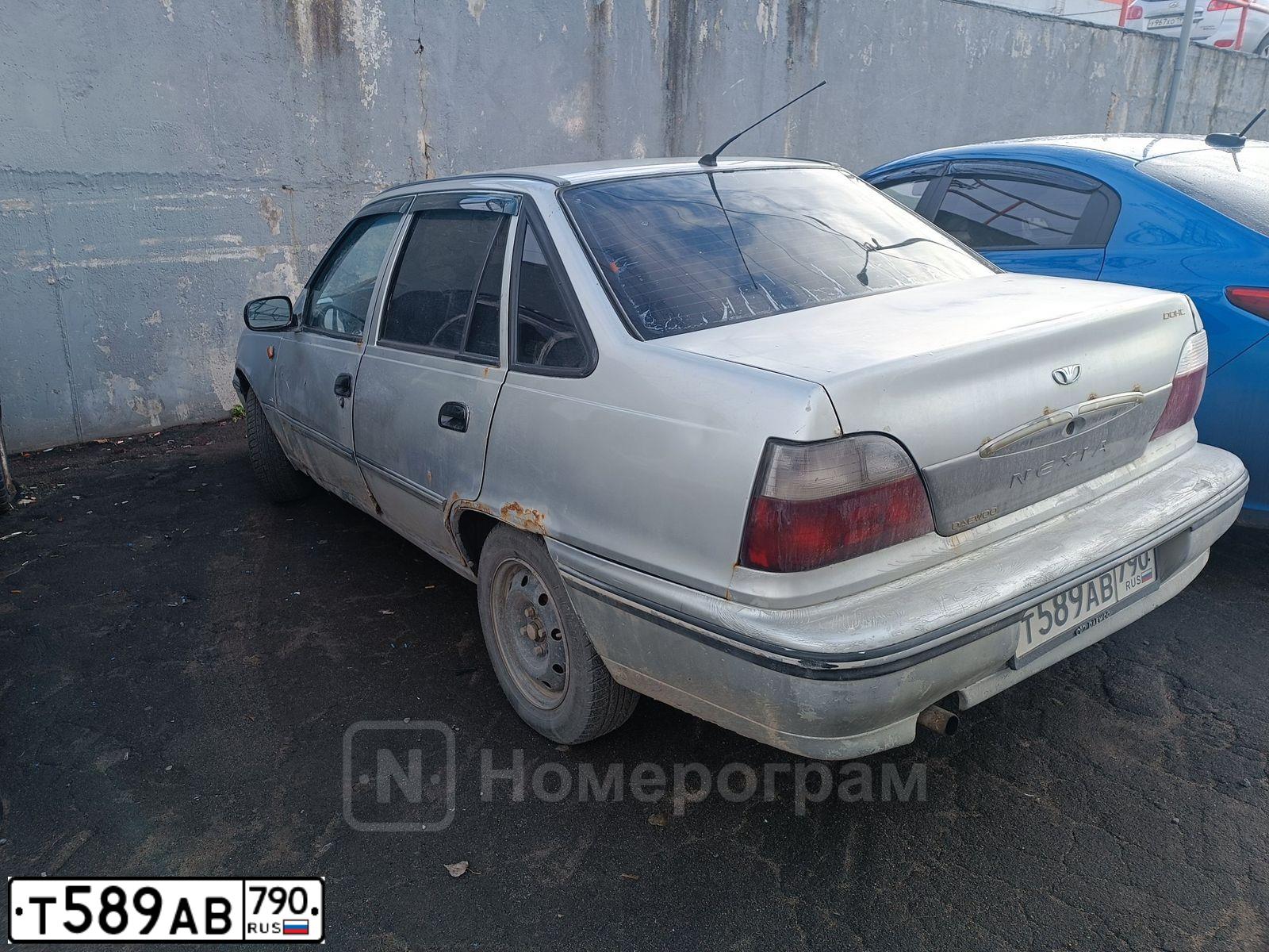 Фото автомобиля DAEWOO NEXIA, 2006 — госномер Т589АВ790. Цвет: БЕЛЫЙ СЕРЕБРИСТЫЙ