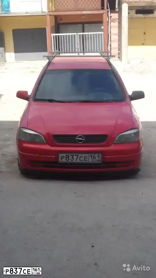Фото автомобиля OPEL ASTRA, 1998 — госномер М424АН82. Цвет: Красный