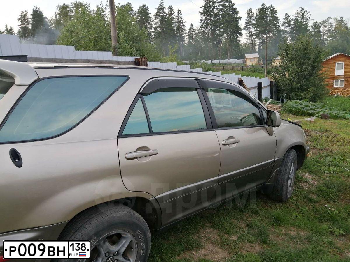 Фото автомобиля LEXUS RX, 2002 — госномер К618ЕР138. Цвет: ЗОЛОТИСТЫЙ
