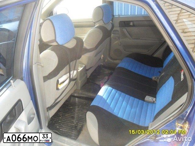 Фото автомобиля CHEVROLET LACETTI, 2006 — госномер Е136НВ177. Цвет: СИНИЙ