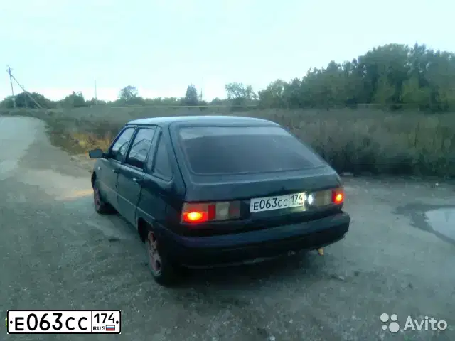 Фото автомобиля IZH 2126, 2004 — госномер Е063СС174. Цвет: Темно-зеленый