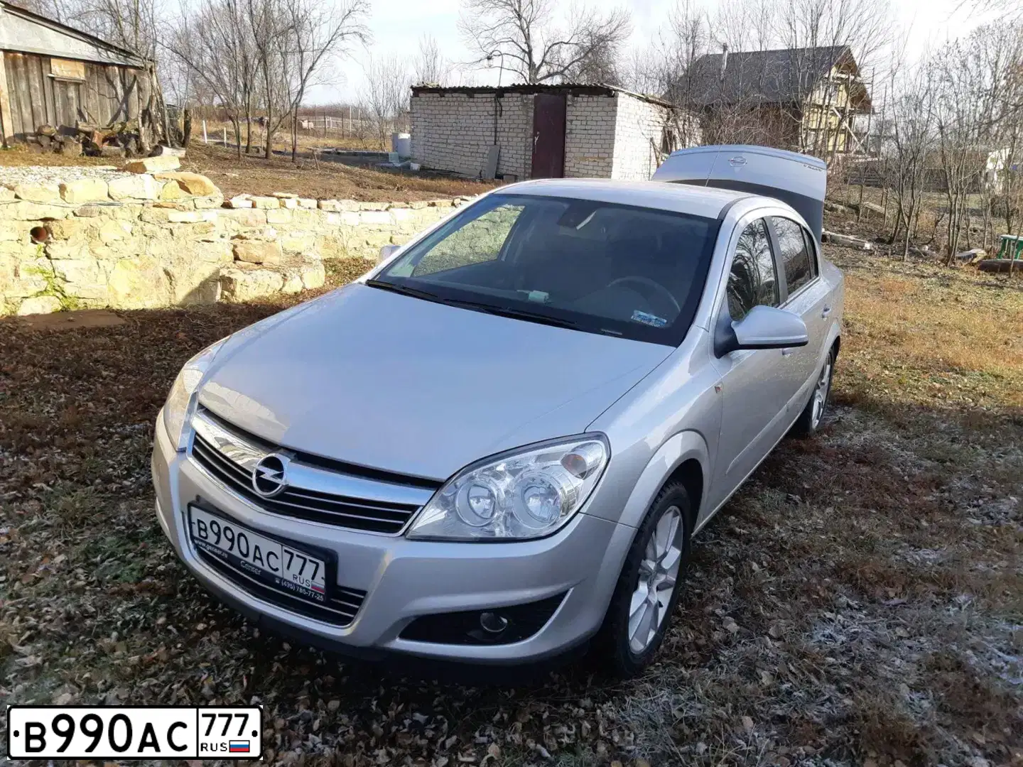 Фото автомобиля OPEL ASTRA, 2013 — госномер Н143ВУ136. Цвет: Серебристый