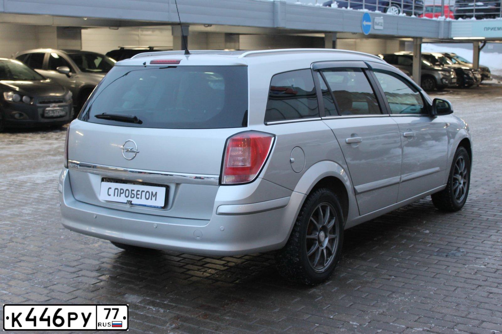Фото автомобиля OPEL ASTRA, 2011 — госномер К446РУ77. Цвет: Серебристый